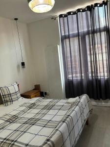 Postel nebo postele na pokoji v ubytování Suzanne house