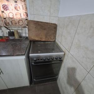 a kitchen with a stove top oven in a kitchen at very spacious house equipped for 4 people in Resistencia +10 photos