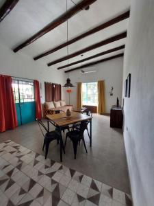 a living room with a table and a couch at Cabañas Dos Teros in Raco