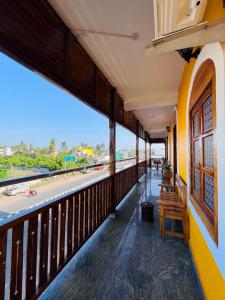 a building with a balcony with a view of the ocean at THE LUXE HOTEL - Pondicherry - JR Groups in Puducherry +83 photos