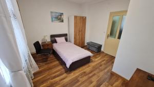 En eller flere senge i et værelse på Sabina apartmani