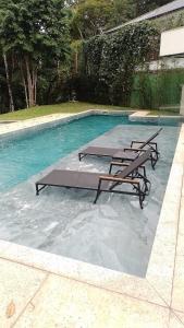 Swimmingpoolen hos eller tæt på Mansão de Luxo em Domingos Martins