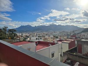 a view of a city from the roof of a building at Hostel Dar Khelifa in Tétouan