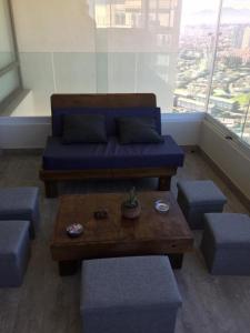 a living room with a couch and a coffee table at Concón Apartment in Concón