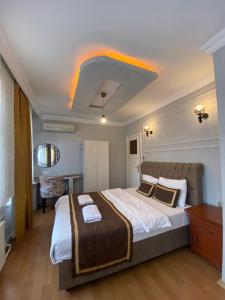 a bedroom with a large bed in a room at Divan Wooden Guesthouse in Istanbul +8 photos