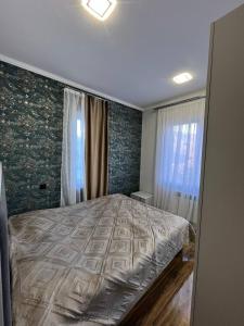 a bedroom with a large bed in a room at Дома в Дилижане in Dilijan