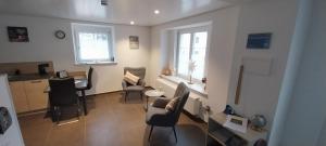 Et opholdsområde på Ferienwohnung Bettina + 5 billeder