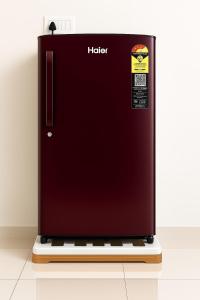 a black refrigerator with a sticker on the side at 2 Bhk Mayra Homes in Raipur