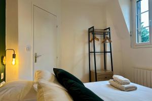 En eller flere senge i et værelse på Casa Mialet - Petit Écrin de Douceur au cœur de Brive