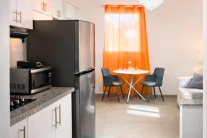 Kuchyň nebo kuchyňský kout v ubytování Harmonia - Sunbeha resort, Juan Dolio