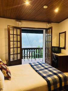 En eller flere senge i et værelse på Geres Mountain View Guest House