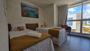 Postel nebo postele na pokoji v ubytování Casa Brisa Cond Naluum by ReservaMilagres + 63 fotografií