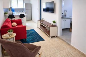 TV a/nebo společenská místnost v ubytování Harmonia - Sunbeha resort, Juan Dolio