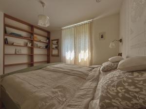 a bedroom with a large bed and a window at 4borovice in Velká Lečice