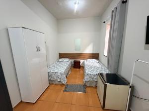 En eller flere senge i et værelse på Hotel Colombo