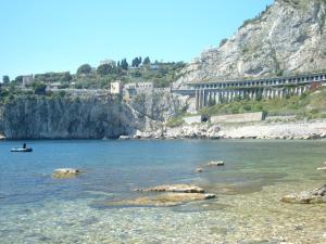 a view of a body of water with a mountain at Taormina Bay Lucia's House Roccalumera in Roccalumera +36 photos