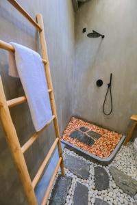 a bunk bed in a bathroom with a shower at Arcadian Weligama in Weligama