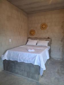 En eller flere senge i et værelse på Yahweh Guriú