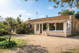 an exterior view of a house with a yard at Es Marroig Villa y Spa in Llucmajor