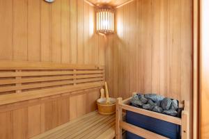 a sauna with wood paneled walls and a wooden floor at Es Marroig Villa y Spa in Llucmajor
