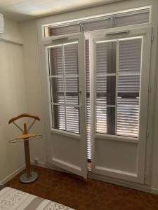 En eller flere senge i et værelse på Appartement F2 agréable avec terrasse + 6 billeder