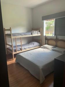 En eller flere senge i et værelse på Recanto do Sol Bragança Pta SP