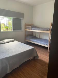 En eller flere senge i et værelse på Recanto do Sol Bragança Pta SP