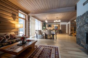 a living room with a couch and a table at Domek nad Potokiem 2 in Nowy Targ
