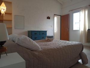 En eller flere senge i et værelse på Casa Boreal dptos estilo casa