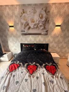 En eller flere senge i et værelse på Cosy appart hotel Bouznika