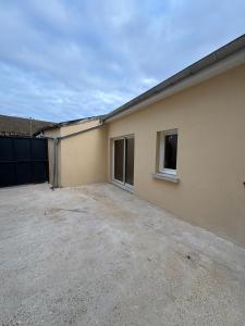 a house with a garage and a driveway at Escapade à Pierry in La Celle-sous-Gouzon