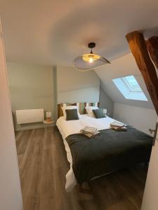 a bedroom with a large bed and a skylight at Nuit D'or - Escapade à Pierry - Séjour & Pro in Pierry +19 photos