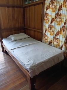 En eller flere senge i et værelse på Cabinas Cocalitos