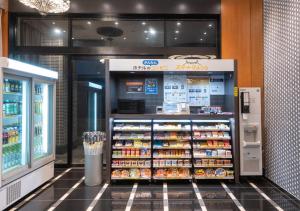 a soda machine in a grocery store with at APA Hotel Ayase Ekimae in Tokyo