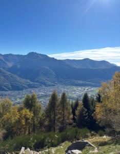 a view from the top of a hill with mountains at Rustico Guidotti in Bellinzona +7 photos