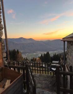 a view of the mountains at sunset from the porch of a house at Rustico Guidotti in Bellinzona