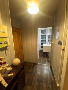 a hallway with a counter and a sink in a room at Studio de la Doller in Masevaux +17 photos