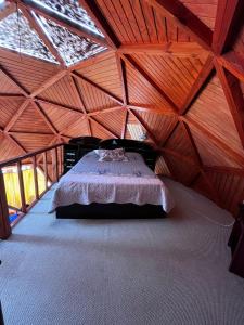 En eller flere senge i et værelse på Domo Algarrobo Bosque y Mar