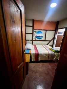 En eller flere senge i et værelse på CasaYaja