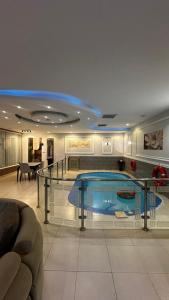 a large swimming pool in a large room at شاليه ايلان المدينة المنورة in Medina