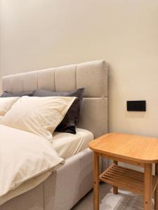 En eller flere senge i et værelse på Vog Villa