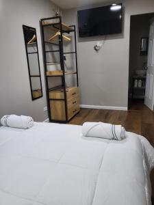 En eller flere senge i et værelse på Santa Catalina Surf Studio