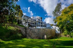 a large house on top of a stone wall at CASONA San Geronimo in Atotonilco el Alto