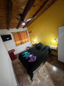 En eller flere senge i et værelse på MALARGÜE STYLE EXMAT CÉNTRICO,UBICADISIMO + 8 billeder