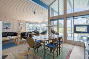 a living room with a table and chairs at 546-Thisted-Kuttervej-16 in Thisted