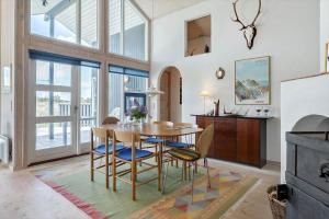 a dining room with a table and chairs at 546-Thisted-Kuttervej-16 in Thisted +11 photos