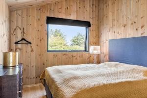 a bedroom with a large bed and a window at 157-Thisted-Isfuglevej-17 in Thisted