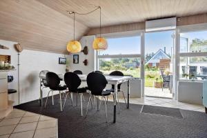 a dining room with a white table and chairs at 332-Thisted-Kristinesvej-32 in Thisted