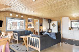 a living room with a couch and a table at 862-Thisted-Nordsovej-162 in Thisted