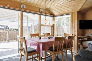 a dining room with a pink table and chairs at 862-Thisted-Nordsovej-162 in Thisted